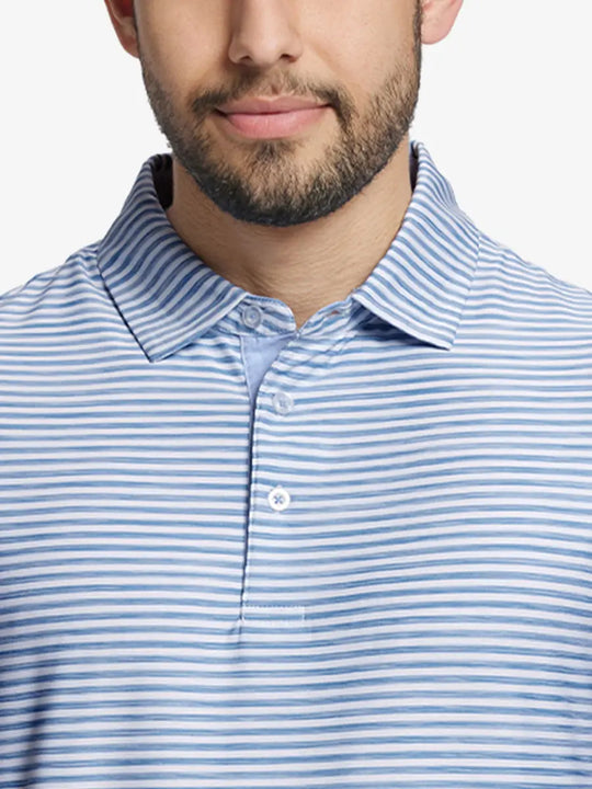 Close-up from nose to chest of SKY BLUE WHITE polo with fresh, airy watercolor stripe design
