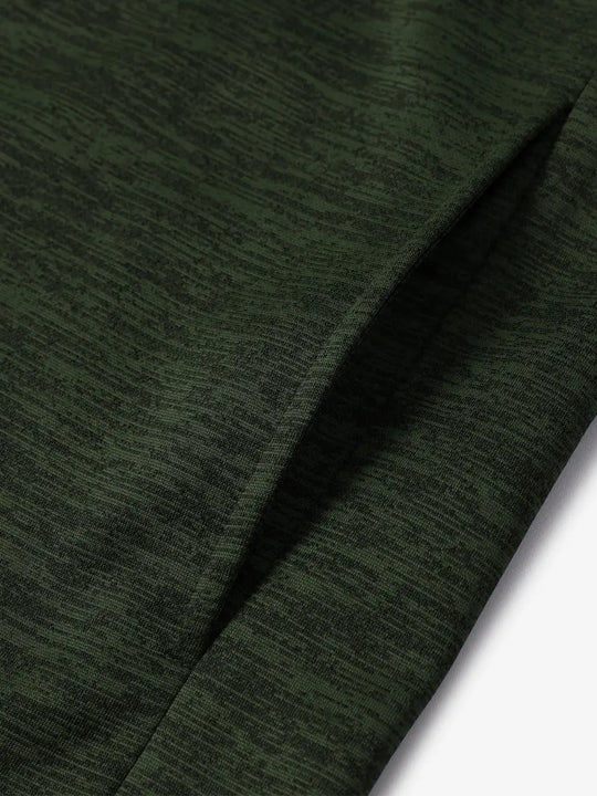 Close-up of right pocket showing fleece lining and seam details on Dark Green Heather hoodie
