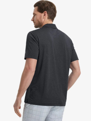 Back view from waist up showing the fit of BLACK 4 Way Stretch Jacquard Polo on model