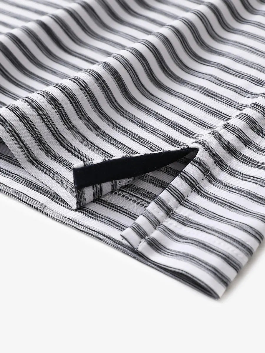 Close-up of hem slit detail on BLACK WHITE Unique Watercolour Stripe Polo