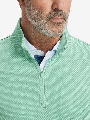 Close-up of collar area on jacquard quarter zip pullover in light green, highlighting refined jacquard detail.