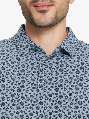 Front half-body view from nose to chest of model wearing GRAYISH BLUE FLOWER Popular Heather Print Polo