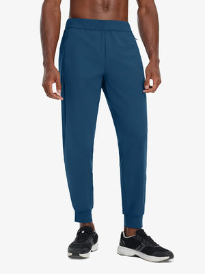Front lower body view of model wearing BLUE INDIGO Performance Tapered Sports Joggers