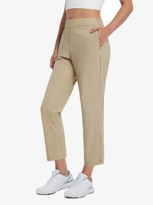Front lower-body view of model with right hand in pocket wearing Khaki Women's 7/8 Ankle Golf Track Pants.