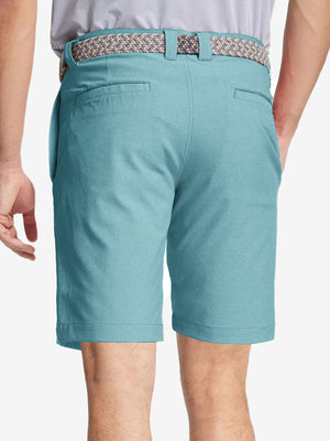 Back view of youth in blue light Heather Performance Golf Shorts, highlighting rear design and fit
