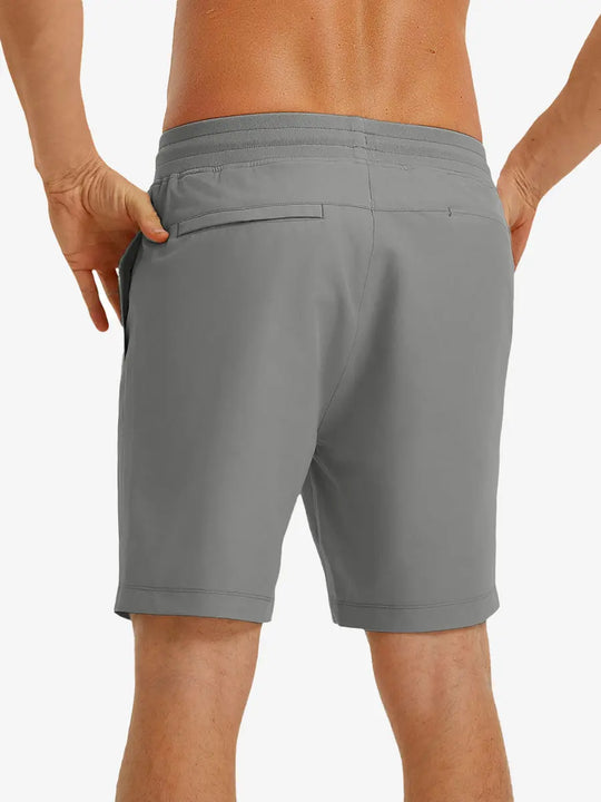 NEUTRAL GREY 9 Inch Performance Active Shorts back view on model