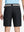Back waist to knee view of black water resistant golf 9 inch shorts, flexible performance fit.