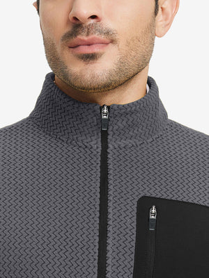 Close-up from nose to chest, showing collar detail of midweight warm stretchy quarter zip pullover in grey.