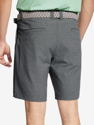 Back view of youth in dark grey Heather Performance Golf Shorts, highlighting rear design and fit