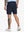 Back lower-body view of model in NAVY Water Resistant Versatile 8 Pockets Shorts.