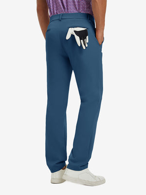 Back view of model wearing water-resistant golf stretch nylon pants, tailored stretch fit in blue indigo.