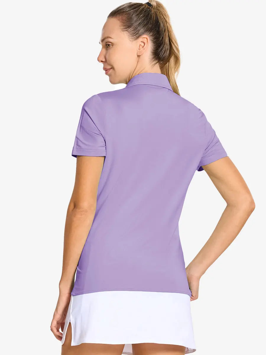 Back-side half-body shot of model in LILAC Women's Performance Solid Polo, looking over shoulder