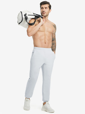 Full body front view of model wearing Water Resistant Comfy Fleece Golf Joggers in misty grey