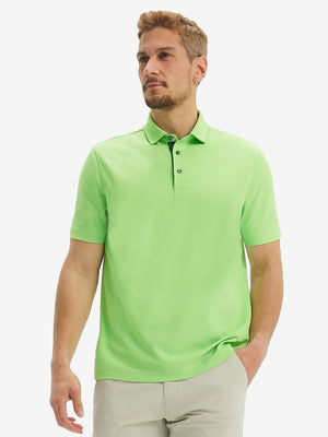 Front half-body shot of model wearing the turquoise green ventilated pique performance polo for a casual sporty look