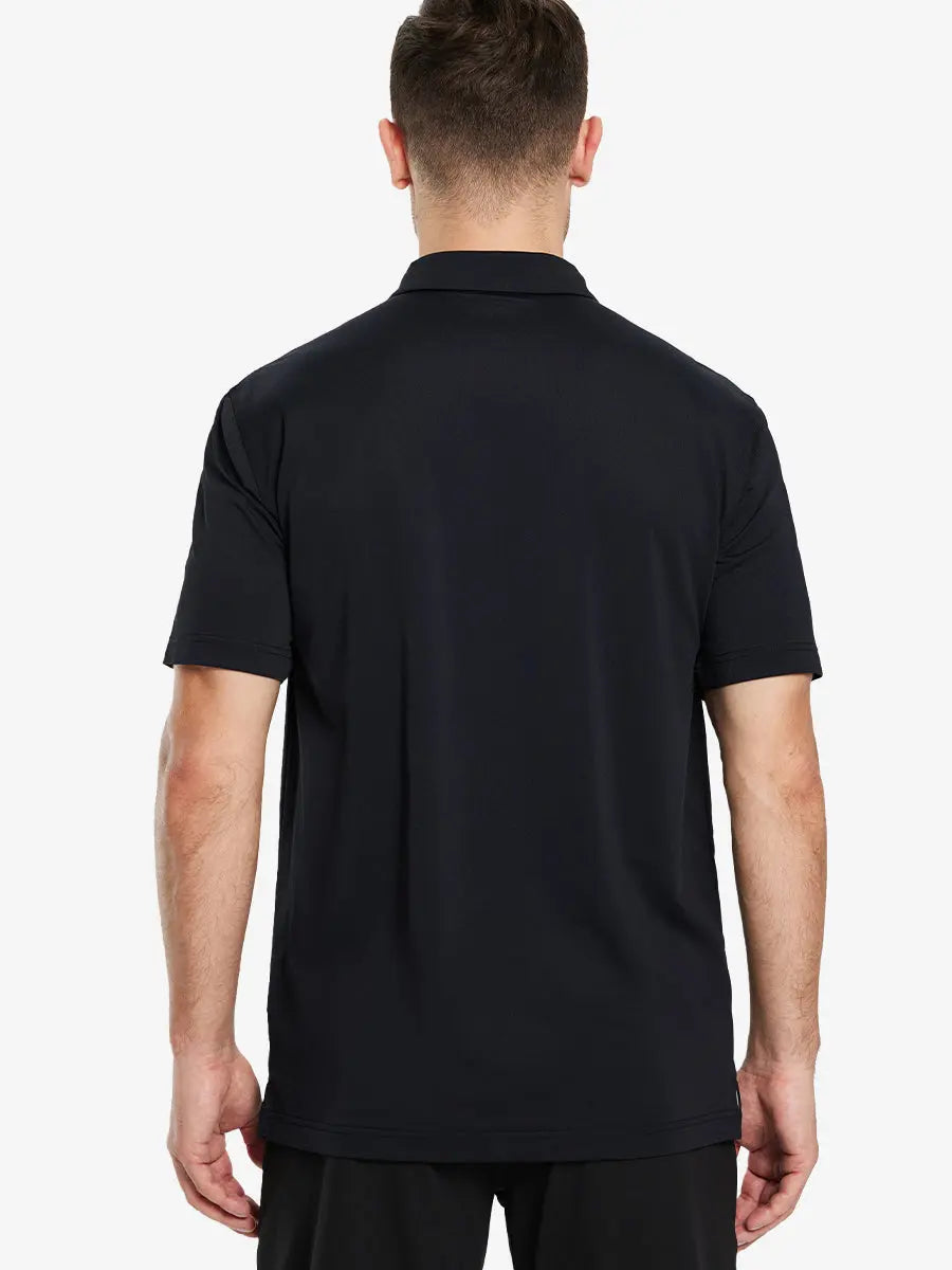 Back view half-body of model in BLACK Ventilated Pique Performance Polo