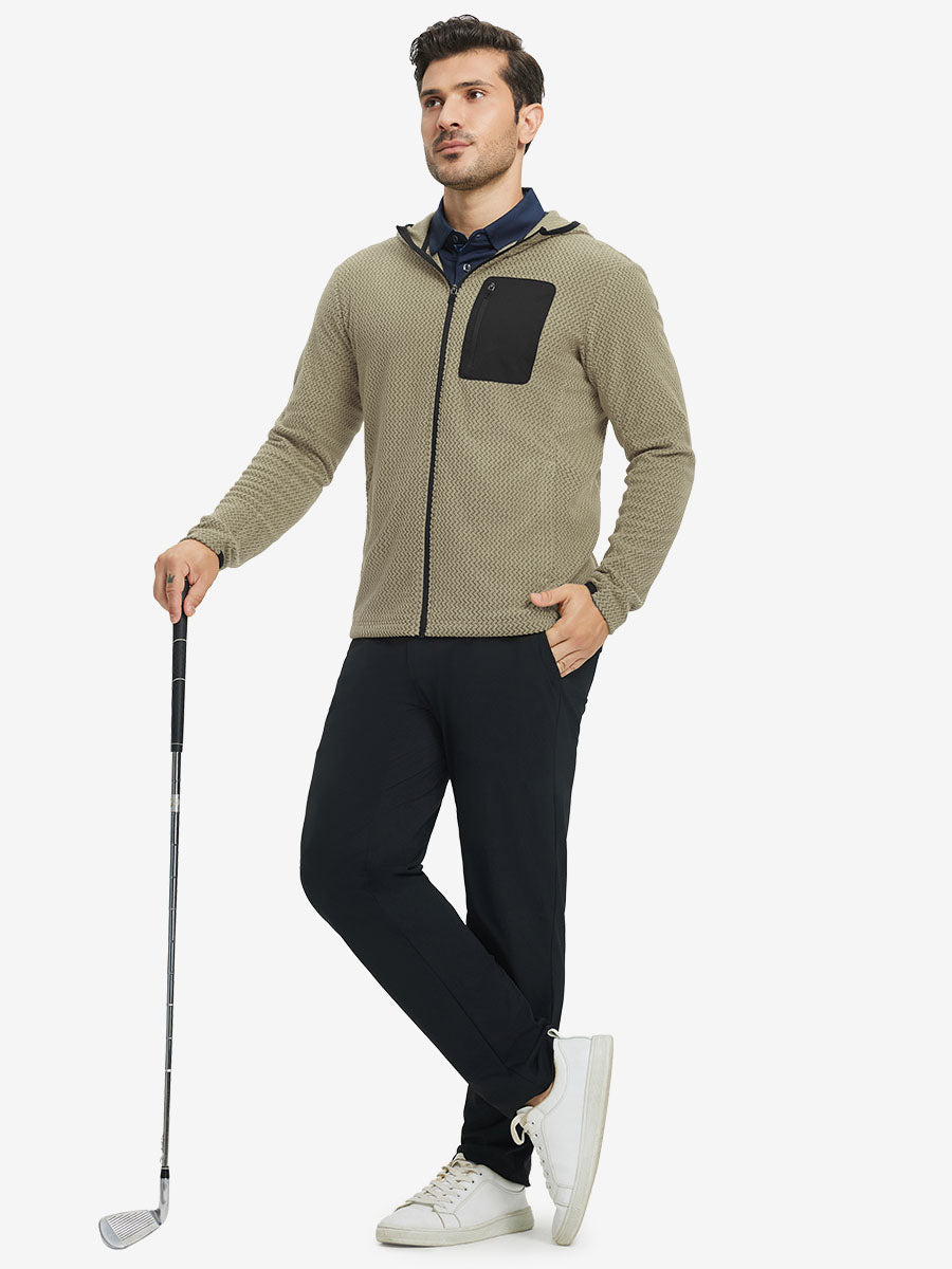Model holding golf club, dressed in full zip fleece hoodied jacket in desert yellow, sporty and casual.