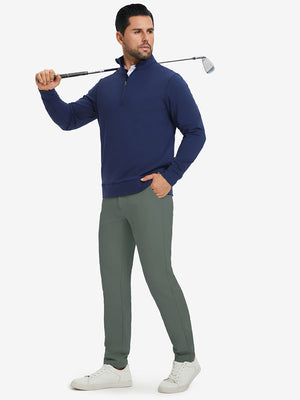 Model carrying a golf club on shoulder, wearing slate green lightweight moisture wicking dress pants.