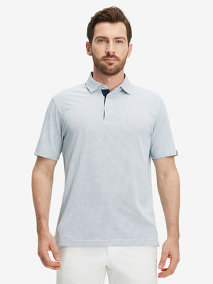 Front half-body view of a model wearing the navy feather weight jacquard polo shirts, showing the chest pocket