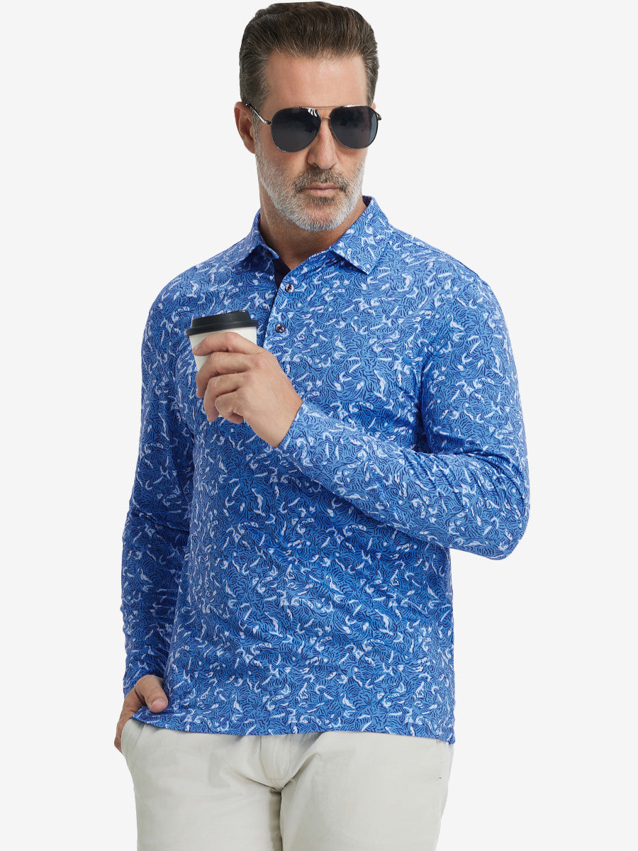 Front upper body view of model standing, holding coffee cup, wearing lightweight print long sleeve polo in line animal.