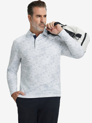 Model carrying golf bag, styled in gray ink splash lightweight print long sleeve polo, sleek golf outfit.