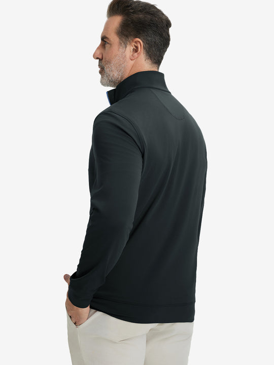 Back upper body view of the dark grey lightweight golf pullover, model turns head slightly with ease.