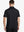 Back half-body view of male model wearing the Black Everyday Classic Solid Polo