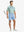 LIGHT BLUE 4-way Stretch Performance Solid Shorts, golfer full-body front with club, 7 Inch length