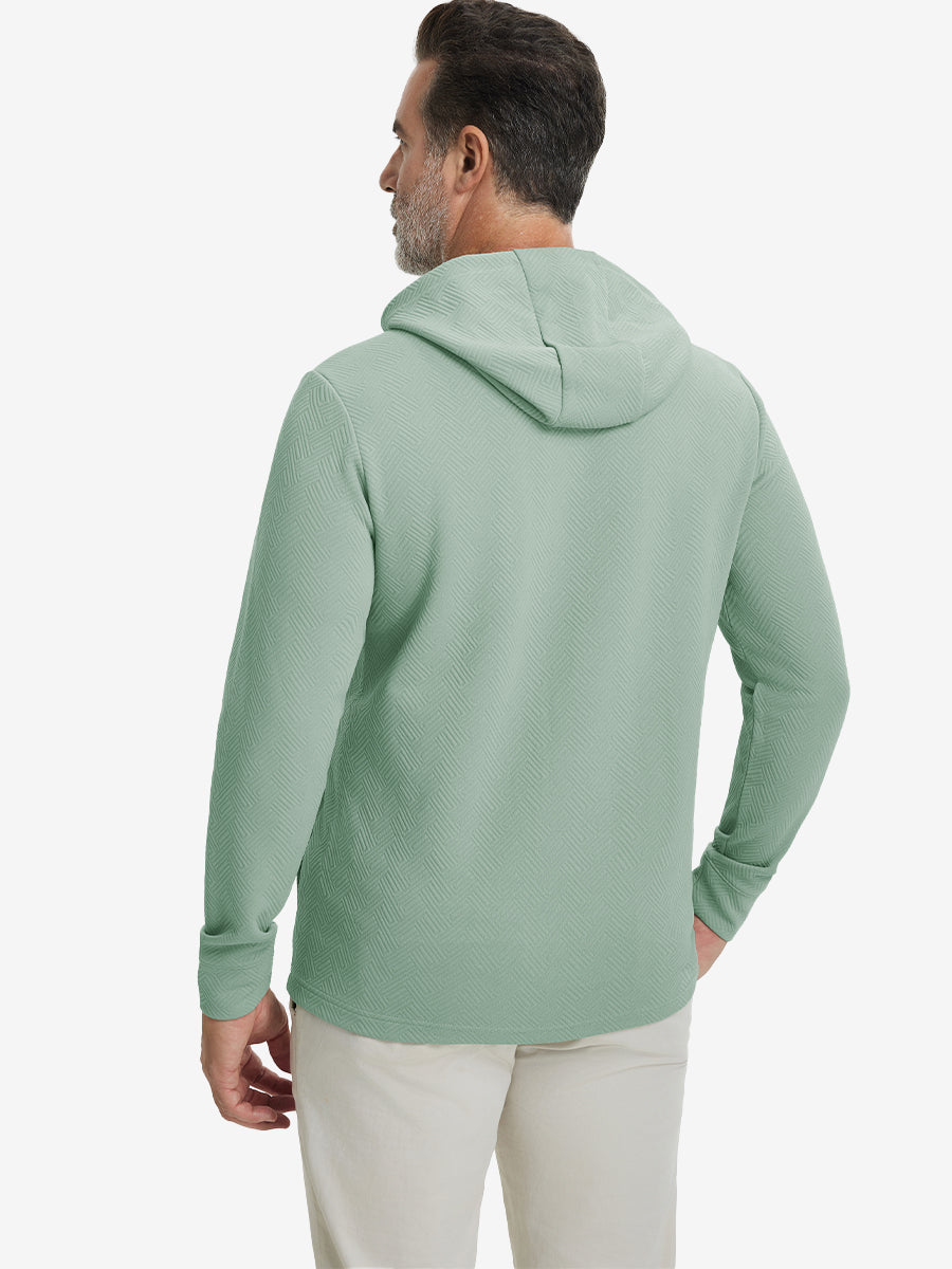 Back view of model wearing texture solid hoodies pullover showing fit and hood detail, beryl green.
