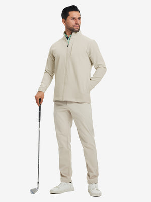 Model holding a golf club, wearing light khaki water-resistant zip up golf jacket in full-body view.