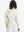 Back upper view of model in women's lightweight hoodies pullover, showing relaxed fit in cream.