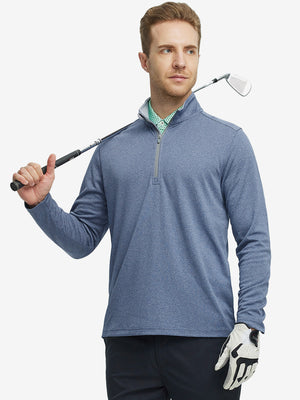 Full-body shot of model holding a golf club in saxony blue melange moisture wicking quarter zip pullover