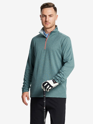 Half-body front shot, model holding golf club in DARK GREEN MELANGE Moisture Wicking Quarter Zip Pullover.