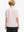 Back half-body view of boy wearing ORANGE SEA WAVE Performance Print Boys Golf Polo outdoors
