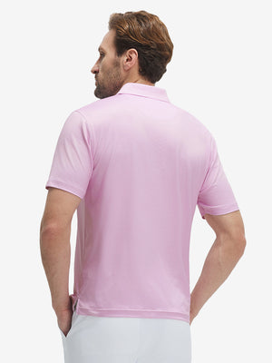 Back waist-up shot of model wearing pink white tee performance quick dry print golf polos
