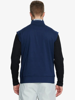 Back half-body view of model in NAVY Stretch Solid Fleece Quarter-Zip Vest.								
