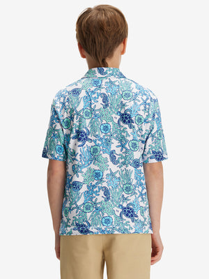 Back half-body of boy in sea turtle performance print boys golf polo