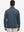 Back upper view of model wearing jacquard quarter zip pullover in black/blue, showing clean seam lines.