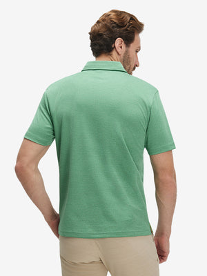 Back waist-up shot of model wearing light green ultra-light quick dry moisture wicking collared polo shirt