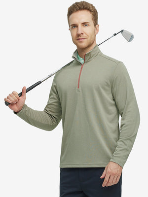 Full-body shot of model holding a golf club in dark khaki melange moisture wicking quarter zip pullover