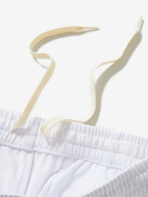 Close-up of the waistband with drawstring detail of white fleece stretch water resistant boys joggers.