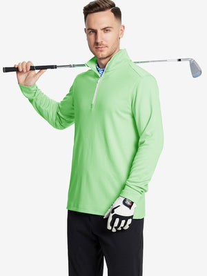 Full-body shot of model holding a golf club in light green melange moisture wicking quarter zip pullover