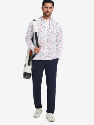 Model carrying a golf bag outdoors, styled in trendy print fleece hoodies with white polka dots