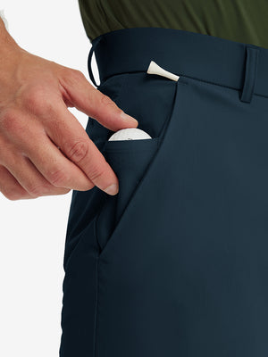 Detail shot of the side pocket on the navy stretch soft flat front dress golf shorts, showing functionality