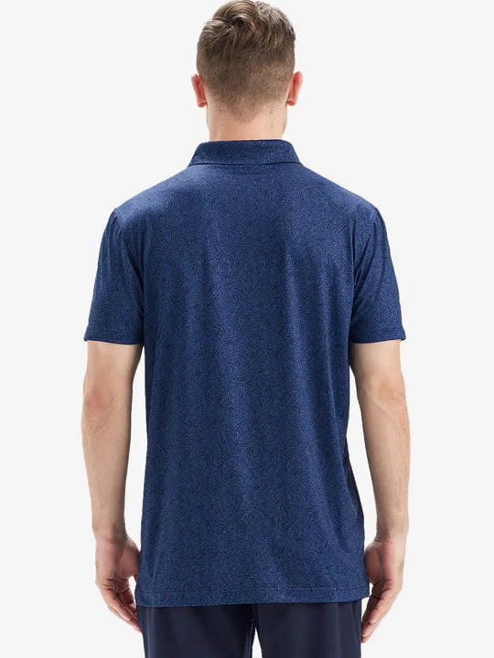 Model is wearing a navy blue leaf patterned polo shirt with a back view showing a natural and fresh design for casual and sporty wear.