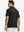 Back half-body view of model in BLACK Stylish Chest Print Snap Polo