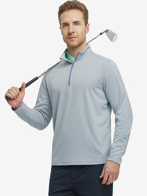 Full-body shot of model holding a golf club in lunar rock melange moisture wicking quarter zip pullover