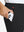 Close-up detail showing phone being placed in the pocket of black water-resistant stretch heat-tech winter trousers