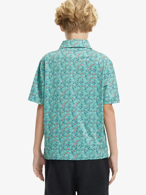 Back half-body view of boy wearing GREEN RUGBY Performance Print Boys Golf Polo outdoors