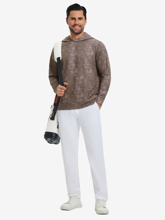 Model carrying a golf bag while wearing exclusive print kangaroo hoodies in grey brown, full-body shot.