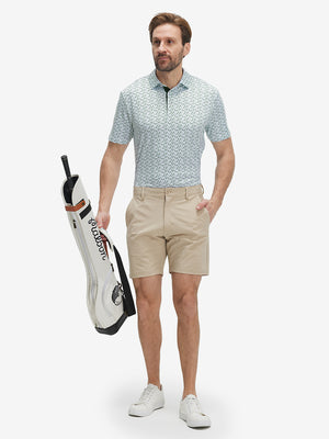 Full-body front view of model wearing the green forest 4 way stretch print collared polo shirt, showing the complete outfit